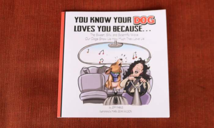 You Know Your Dog Loves You Because... the book's front cover