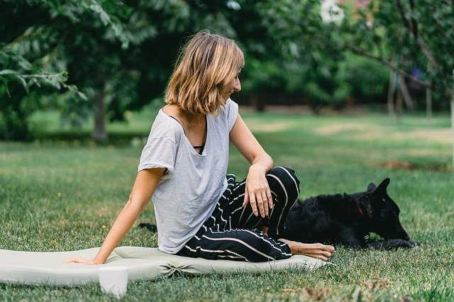 Any dog can promote healthy lifestyles just by getting you out of the house.  This woman is outdoors with her dog.