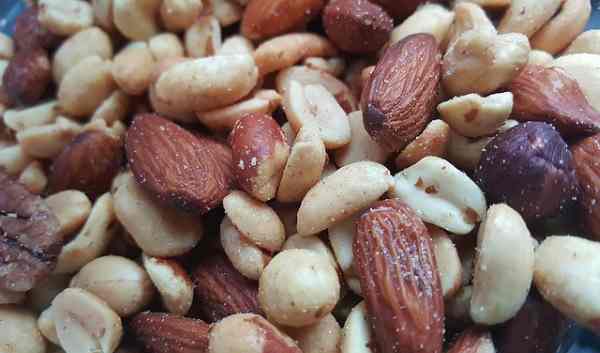 A variety of different types of nuts and peanuts.