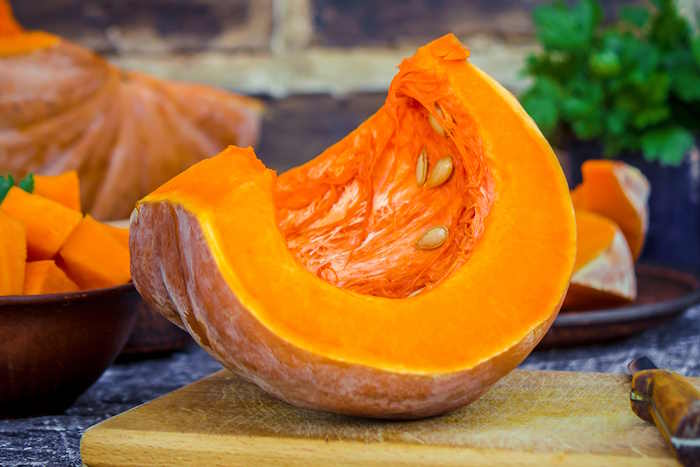 Sliced pumpkin on a wooden table