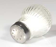 Dogs do not need excess salt in their diet. Limit the amount of salt your dog ingests. Shown is a salt shaker.